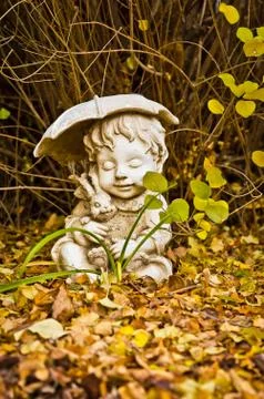 Boy with Umbrella Statue Stock Photos