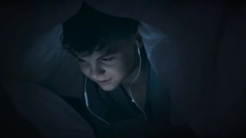 Boy under blanket with tablet Stock Footage 107905035