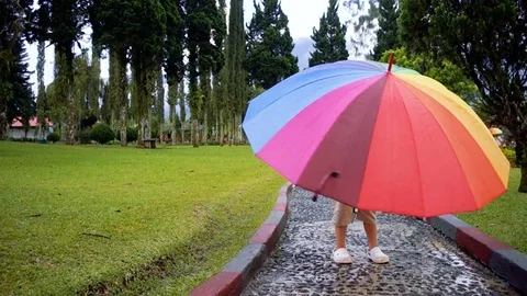The boy under the rainbow umbrella 動画素材 81632492