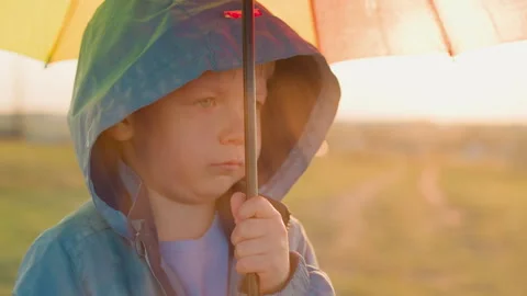 Boy unease amplifies with rain tapping sound Stock Footage 270685458