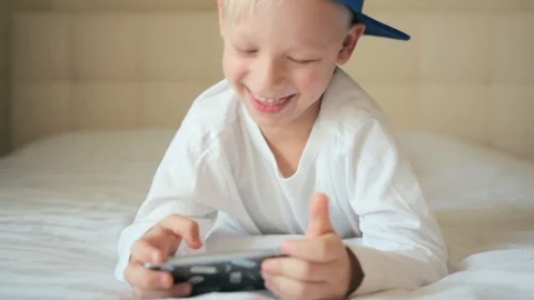 Boy use a mobile phone Stock Footage 105884750