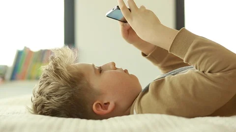  Boy use a mobile phone. Internet gaming disorder. Stock Footage 106396855