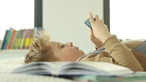 Boy use a mobile phone. Internet gaming disorder. Stock Footage 106396879