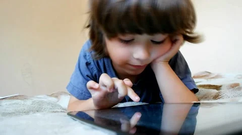 Boy use tablet pc indoors Stock Footage 43743049