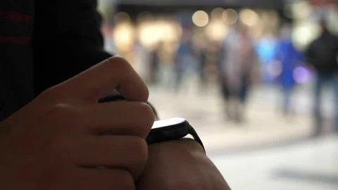 Boy uses new smart watch in supermarket, hand close-up Stock-Footage 168126035
