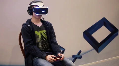 Boy uses virtual reality game development kit, virtual reality glasses Stock Footage 66088710