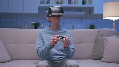 Boy Uses Virtual Reality Glasses for Watch Play Video Gaming and Holding Gadget Vídeo Stock 152283020