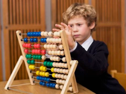 Boy using abacus Stock Photos