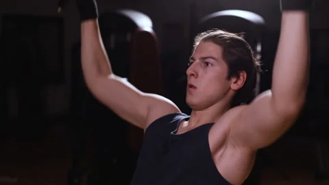 Boy using bodybuilding machine in gym - close up Video stock 154895017