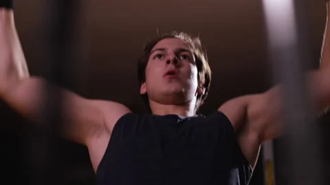 Boy using bodybuilding machine in gym - close up Video stock 155260798