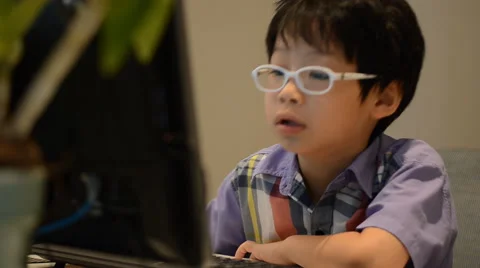 Boy using desktop computer Video stock 52913286