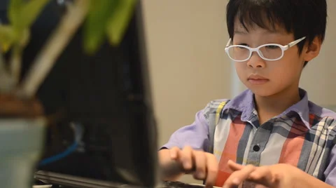 Boy using desktop computer Stock Footage 52913338
