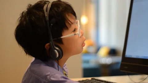 Boy using desktop computer Stock Footage 52914960