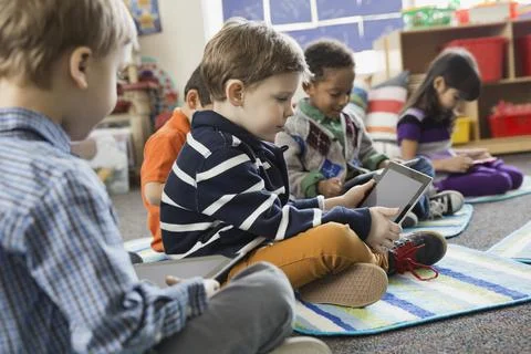 Boy using digital tablet in elementary school 스톡 사진
