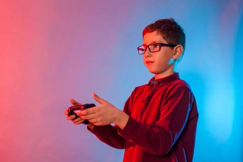 Boy using a gaming gadget for virtual reality in playing game zone Stock Photos