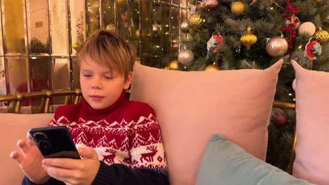 Boy using his Smartphone Stock Footage 258596315