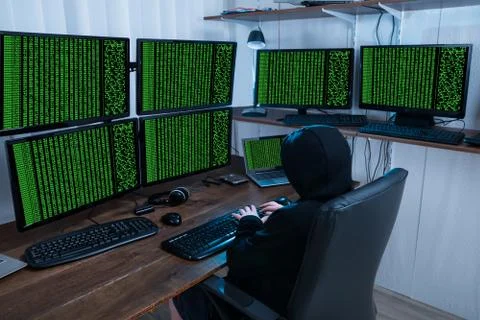 Boy Using Keyboard While Stealing Information From Multiple Computers 스톡 사진
