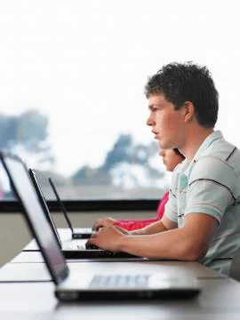 Boy Using Laptop In Computer Class Stock Photos