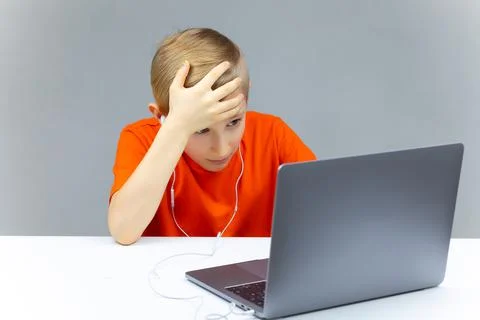 Boy using laptop for online learning Stock Photos