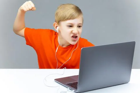 Boy using laptop for online learning Stock Photos