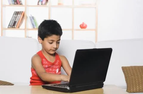 Boy using a laptop Fotos Stock