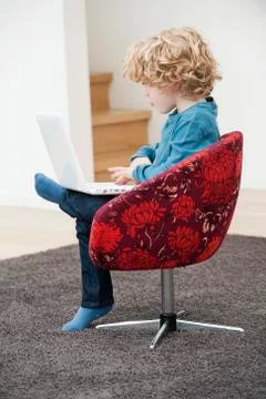 Boy using a laptop Stock Photos