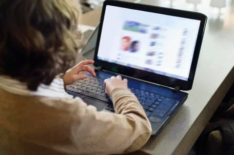 Boy using laptop Stock Photos