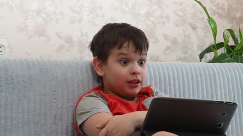 Boy using a laptop playing online games or tablet communicate blogging, studying 库存影片 148633446