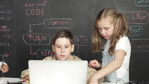 Boy using laptop programing engineering code and writing program. Erudition. Stock Footage 262108968