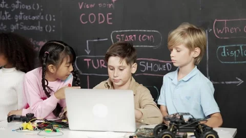 Boy using laptop programing engineering code and writing program. Erudition. Stock Footage 262230143