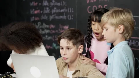 Boy using laptop programing engineering code and writing program. Erudition. Stock Footage 264977723