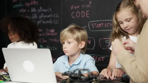 Boy using laptop programing engineering code and writing program. Erudition. Stock Footage 268966868