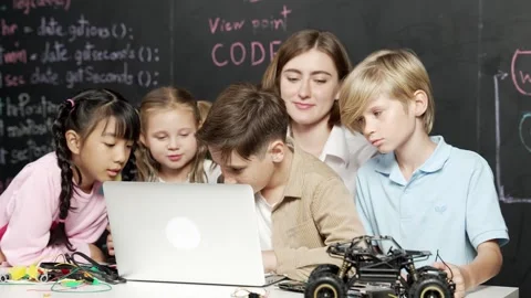 Boy using laptop programing engineering code and writing program. Erudition. Stock Footage 273834154