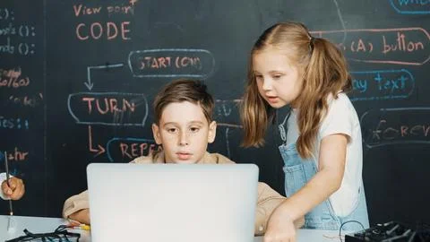 Boy using laptop programing engineering code and writing program. Erudition. Foto stock