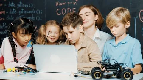 Boy using laptop programing engineering code and writing program. Erudition. Foto stock