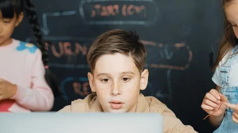 Boy using laptop programing engineering code and writing program. Erudition. Foto stock