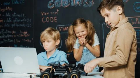 Boy using laptop programing engineering code and writing program. Erudition. Stockfoto's