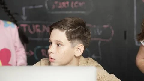 Boy using laptop programing engineering code and writing program. Erudition. Photos