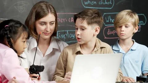 Boy using laptop programing engineering code and writing program. Erudition. 库存照片
