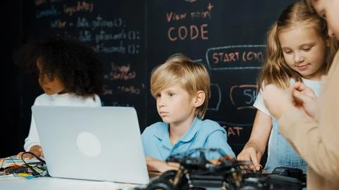 Boy using laptop programing engineering code and writing program. Erudition. Foto stock