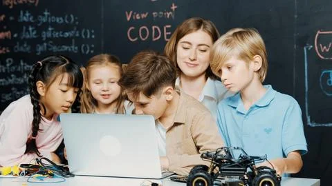 Boy using laptop programing engineering code and writing program. Erudition. Foto stock