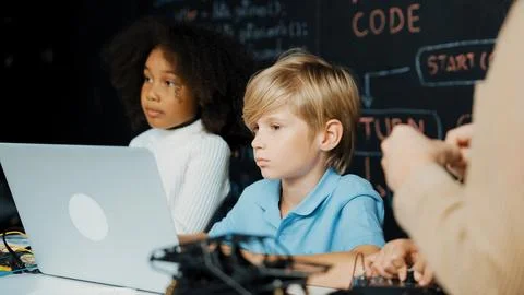 Boy using laptop programing engineering code and writing program. Erudition. Foto stock