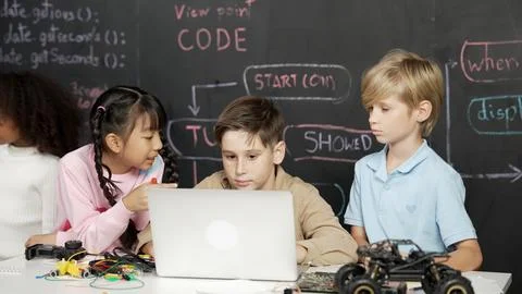 Boy using laptop programing engineering code and writing program. Erudition. Foto stock