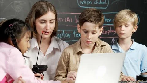 Boy using laptop programing engineering code and writing program. Erudition. Photos