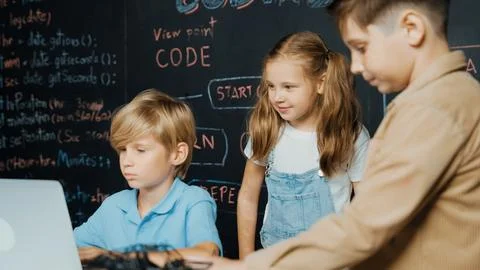 Boy using laptop programing engineering code and writing program. Erudition. Foto stock