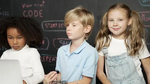 Boy using laptop programing engineering code and writing program. Erudition. Photos