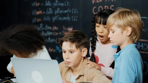 Boy using laptop programing engineering code and writing program. Erudition. Photos