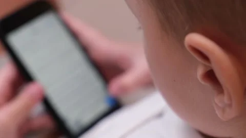 Boy using mobile phone at home. Stock Footage 232680736