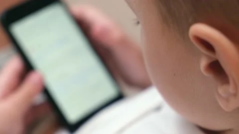Boy using mobile phone at home. Stock Footage 232680747