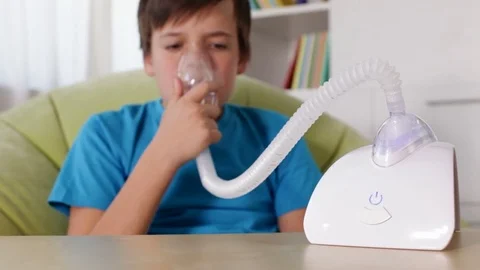 Boy using nebuliser inhaler with mask Stock Footage 80145052